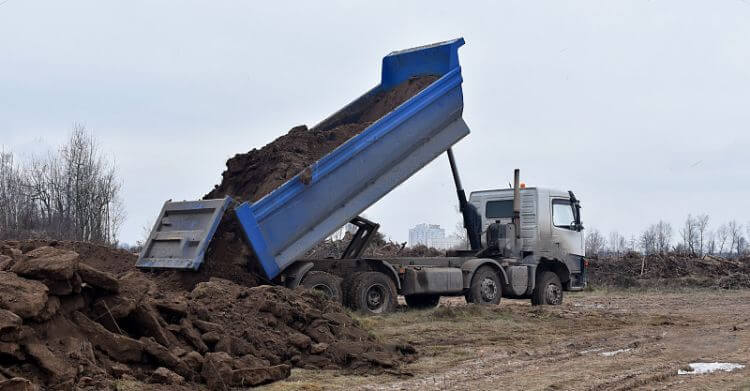 Self-dumping truck